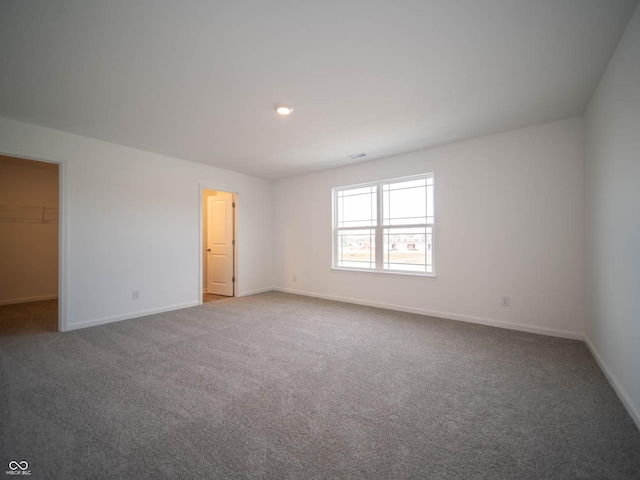 unfurnished room featuring carpet flooring