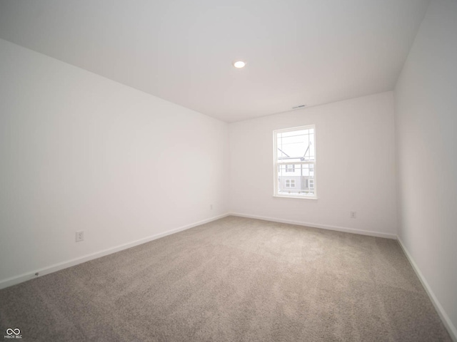 unfurnished room featuring carpet