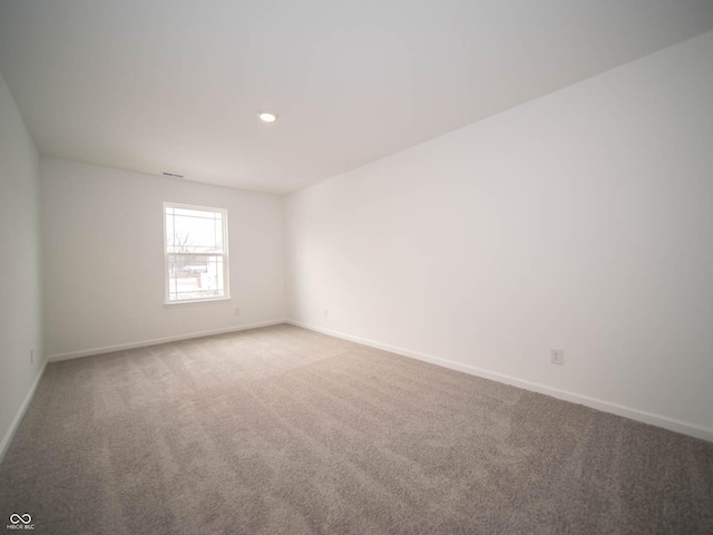 spare room with carpet floors