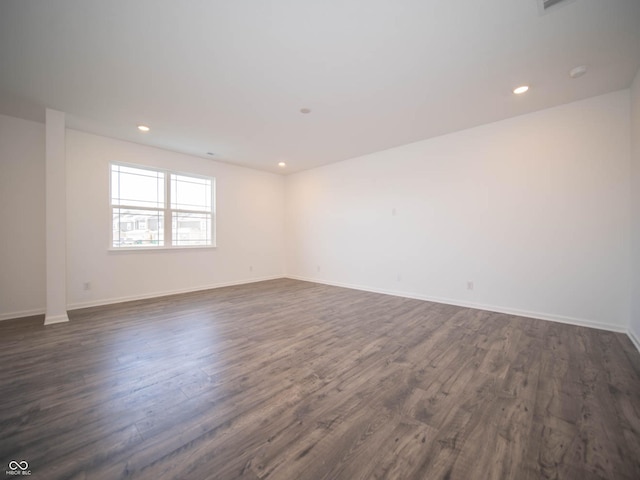 unfurnished room featuring dark hardwood / wood-style flooring