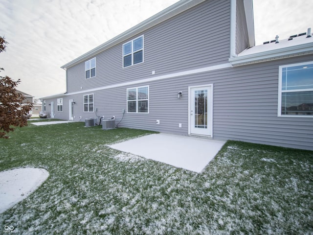 back of house featuring a yard, a patio, and central air condition unit