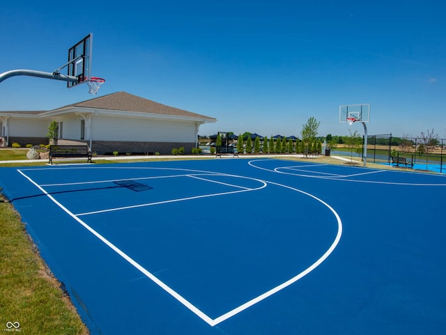 view of basketball court with community basketball court and fence