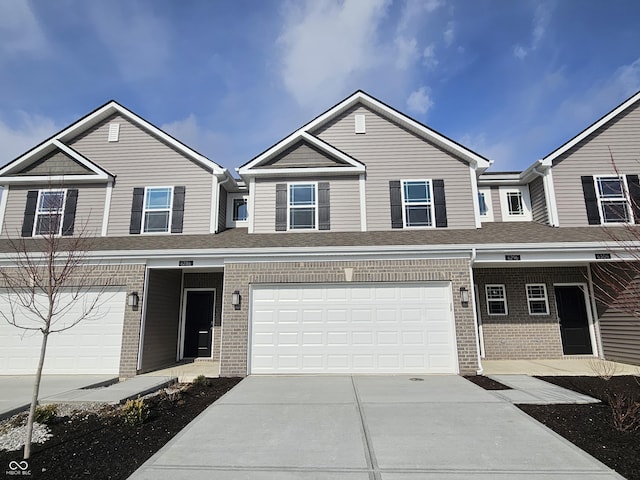 townhome / multi-family property featuring a garage