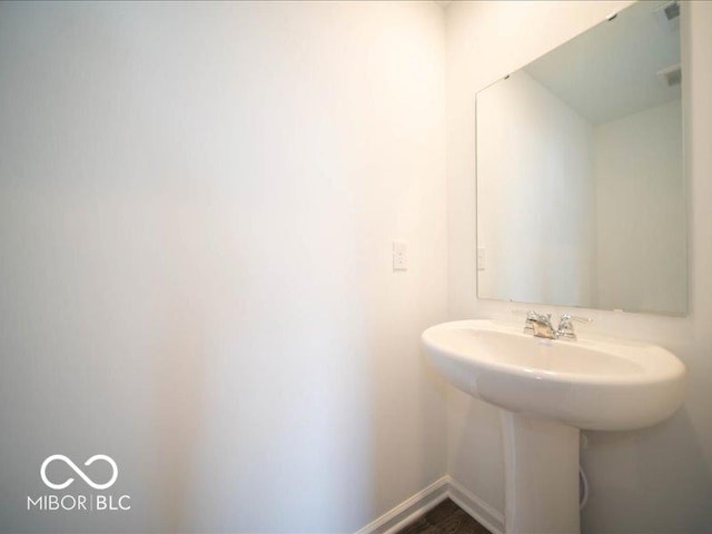 bathroom featuring baseboards