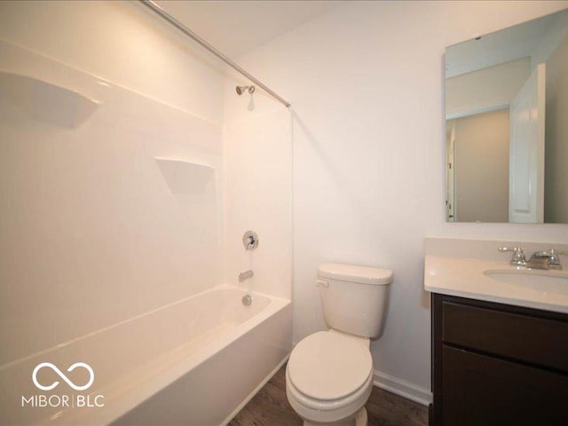 bathroom with shower / washtub combination, baseboards, vanity, and toilet