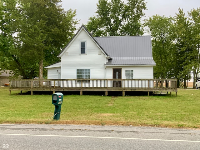 view of front of house with a front lawn and a wooden deck