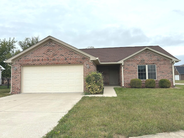 ranch-style home featuring a front lawn and a garage