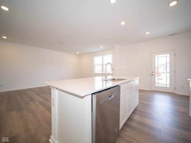 kitchen with white cabinets, dark hardwood / wood-style flooring, sink, stainless steel dishwasher, and a center island with sink