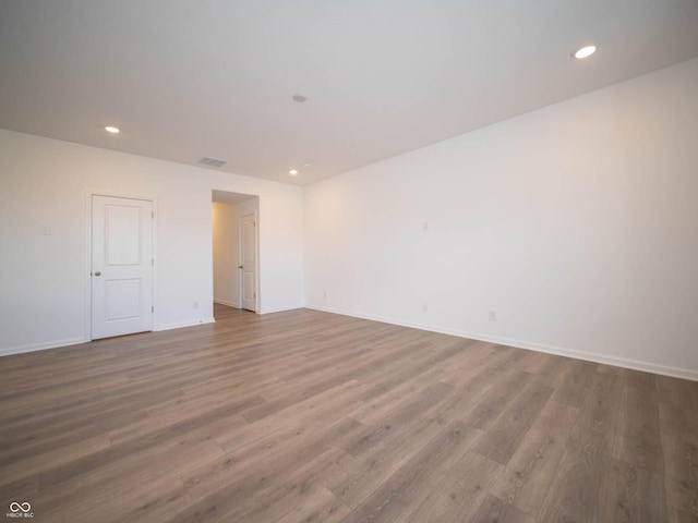 spare room featuring hardwood / wood-style floors