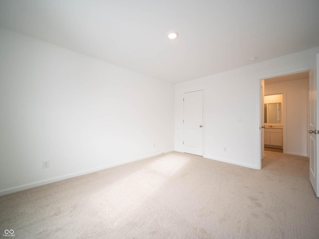 unfurnished bedroom with light carpet