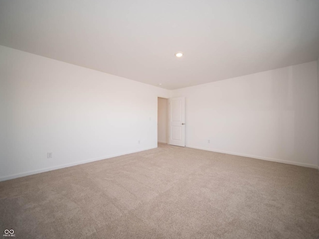 spare room featuring carpet