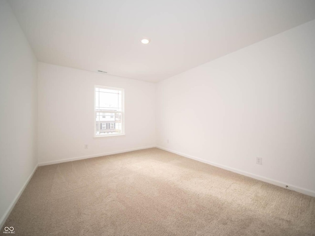 spare room featuring carpet floors