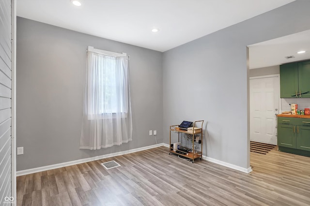 spare room with light hardwood / wood-style flooring