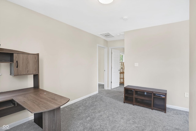 home office featuring dark colored carpet