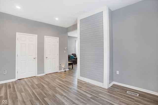 spare room with light hardwood / wood-style flooring