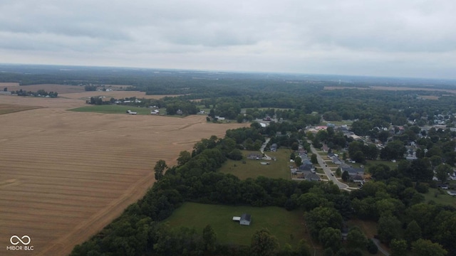 birds eye view of property with a rural view