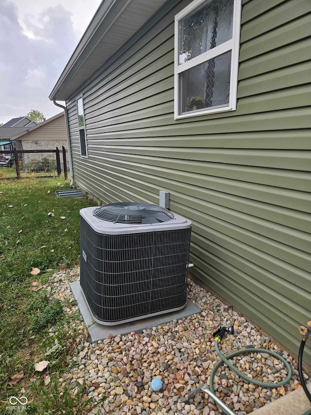 exterior details with fence and cooling unit