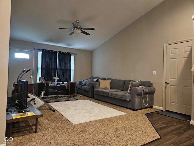 living area featuring ceiling fan, dark wood-style floors, and lofted ceiling