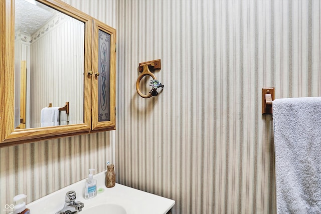 2747 E Midland Rd, Indianapolis, IN 46227 - bathroom with wallpapered walls and vanity