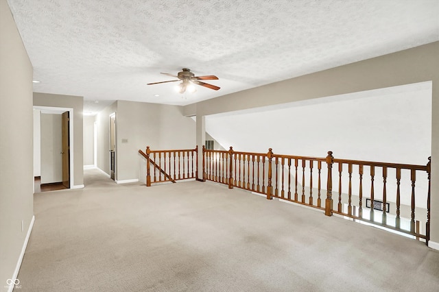 2747 E Midland Rd, Indianapolis, IN 46227 - spare room with a ceiling fan, baseboards, carpet, and a textured ceiling