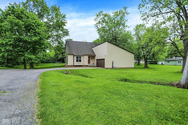 2747 E Midland Rd, Indianapolis, IN 46227 - mid-century home featuring an attached garage, a front yard, and driveway