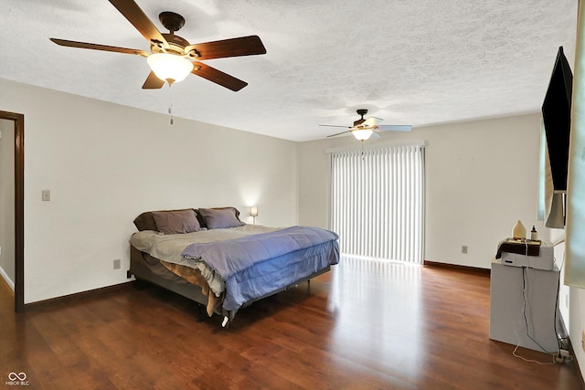 2747 E Midland Rd, Indianapolis, IN 46227 - bedroom featuring baseboards, dark wood-type flooring, a textured ceiling, and a ceiling fan