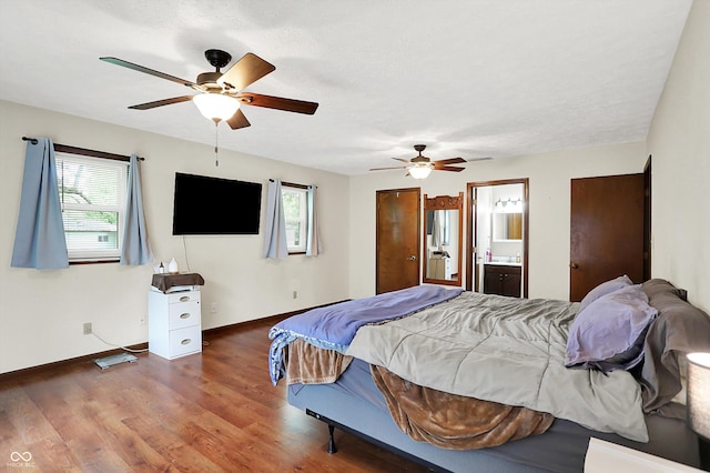 2747 E Midland Rd, Indianapolis, IN 46227 - bedroom featuring multiple windows, baseboards, wood finished floors, and ceiling fan