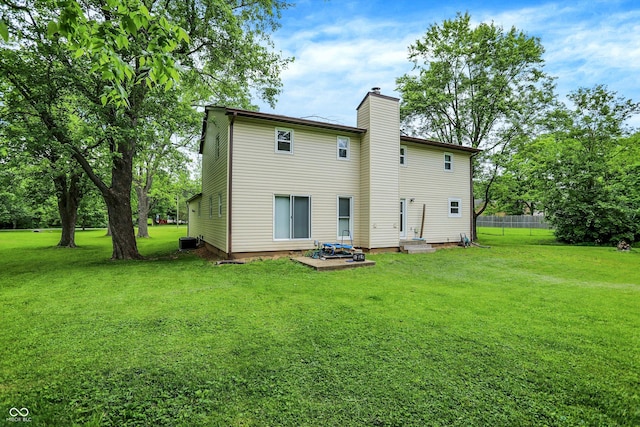 2747 E Midland Rd, Indianapolis, IN 46227 - back of property featuring a chimney and cooling unit