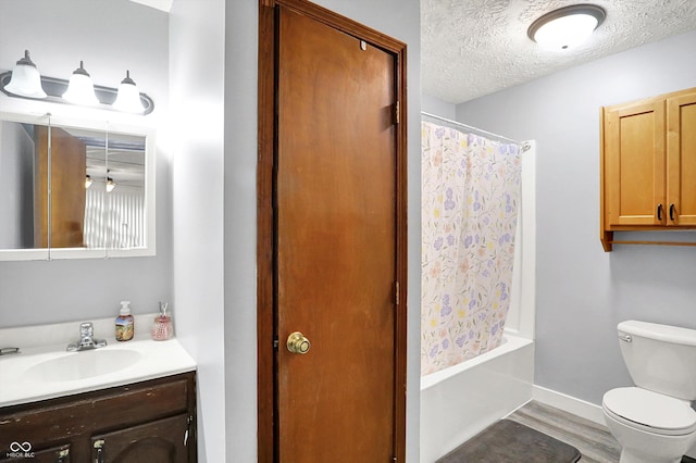 2747 E Midland Rd, Indianapolis, IN 46227 - bathroom with vanity, toilet, wood finished floors, a textured ceiling, and shower / bath combo