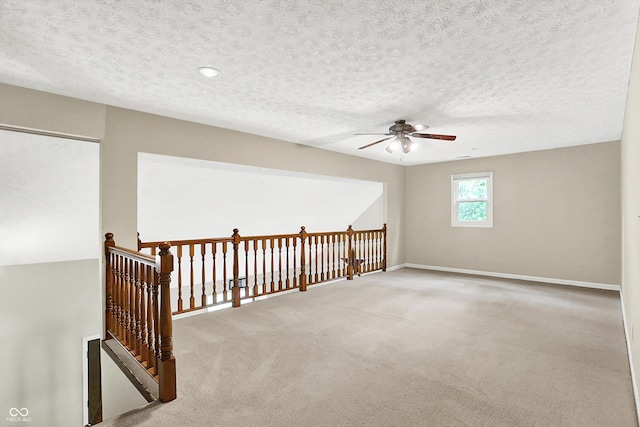 2747 E Midland Rd, Indianapolis, IN 46227 - spare room with a ceiling fan, carpet, a textured ceiling, and baseboards
