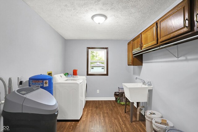 2747 E Midland Rd, Indianapolis, IN 46227 - washroom with washer and dryer, cabinet space, dark wood-style floors, a textured ceiling, and baseboards