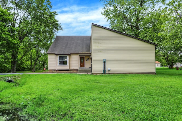 2747 E Midland Rd, Indianapolis, IN 46227 - mid-century inspired home with a front yard and a shingled roof