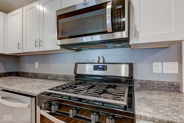 kitchen featuring white cabinetry and stainless steel appliances