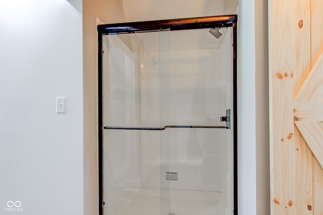 full bathroom featuring a stall shower