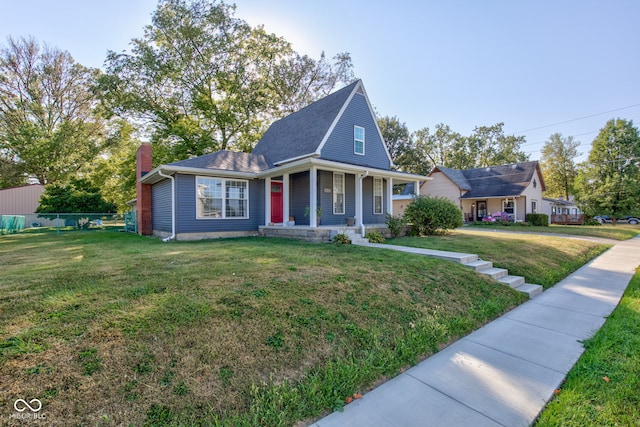 view of front of property featuring a porch and a front lawn