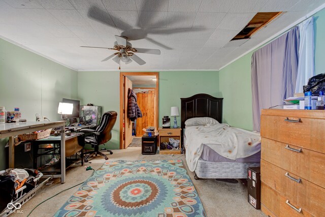 bedroom featuring ornamental molding, ceiling fan, and light colored carpet