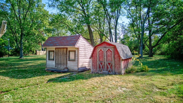 view of outbuilding featuring a lawn