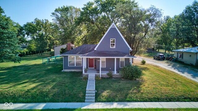 view of front of home featuring a front yard and a porch