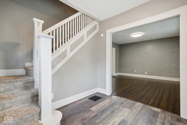 3005 Broadway St, Indianapolis, IN 46205 - stairway featuring wood finished floors, baseboards, and visible vents