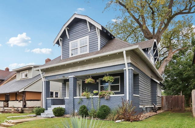 3005 Broadway St, Indianapolis, IN 46205 - view of front of property featuring fence, roof with shingles, and a front yard