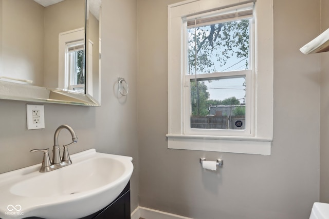 bathroom with a wealth of natural light and vanity