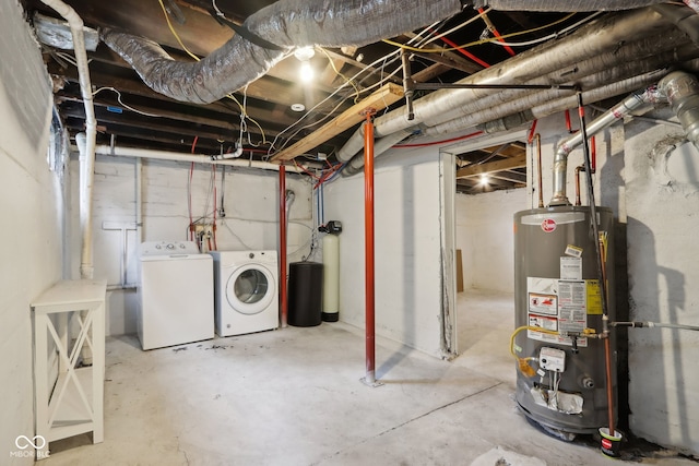 basement with washing machine and clothes dryer and water heater