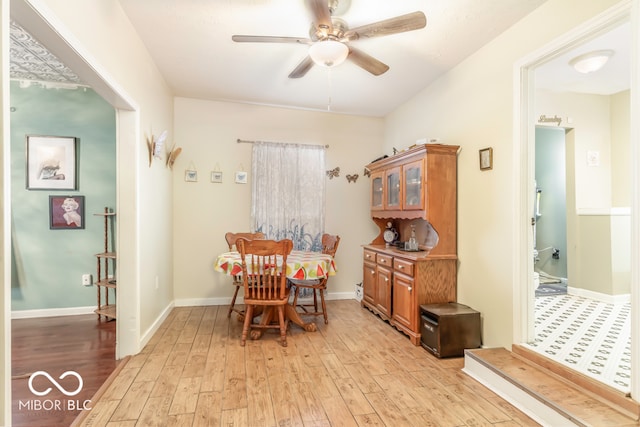 dining area featuring ceiling fan and light wood-type flooring