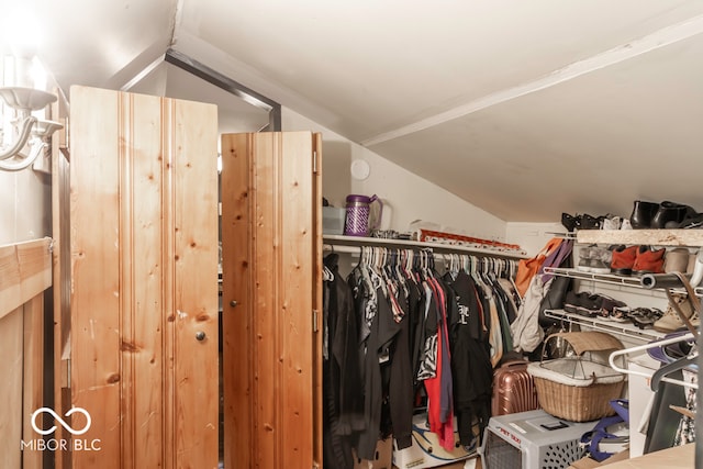 spacious closet featuring vaulted ceiling