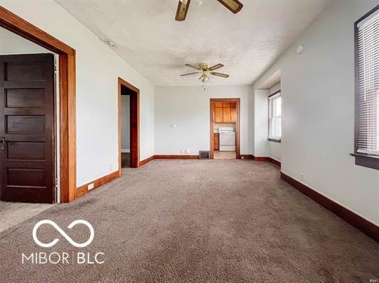 interior space with carpet and a textured ceiling