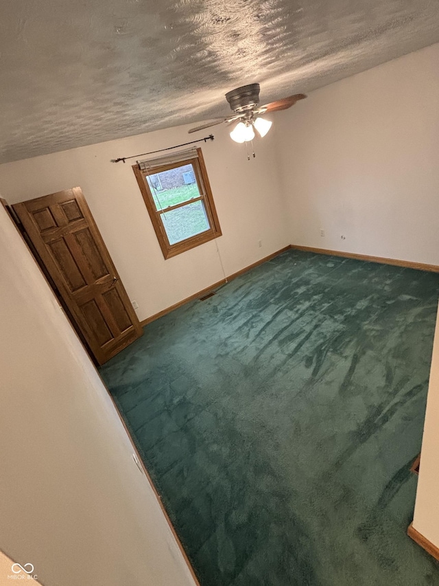 8855 N Waverly Park Rd, Martinsville, IN 46151 - carpeted spare room with ceiling fan, baseboards, and a textured ceiling