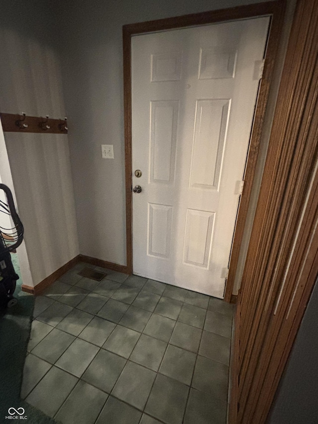8855 N Waverly Park Rd, Martinsville, IN 46151 - entryway with dark tile patterned flooring and baseboards
