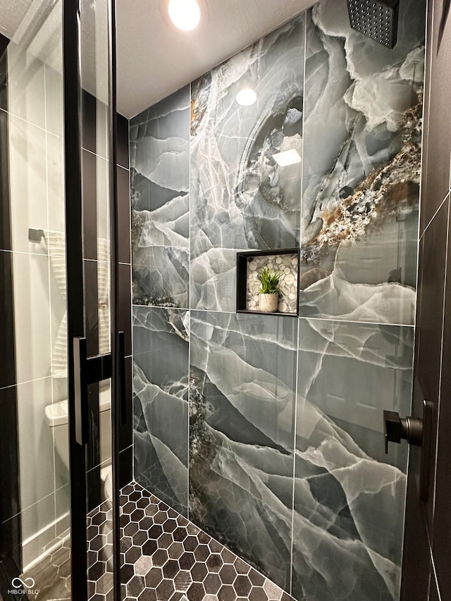 bathroom with an enclosed shower