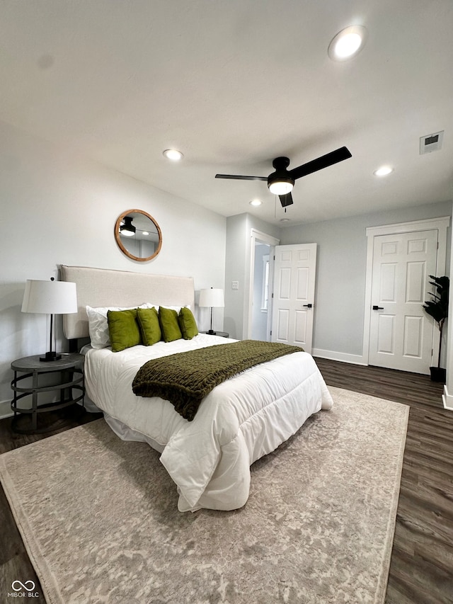 bedroom featuring dark wood-type flooring and ceiling fan