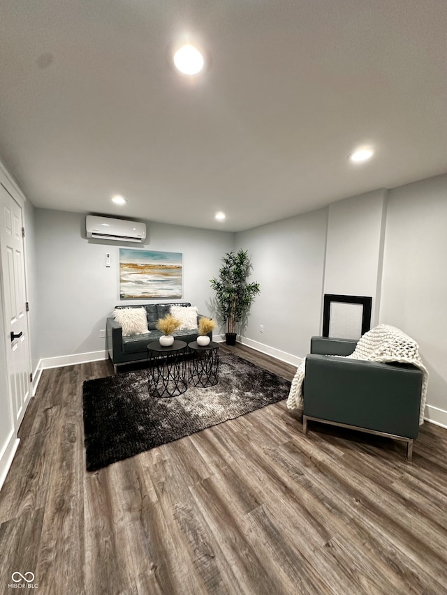 living room featuring a wall unit AC and dark hardwood / wood-style flooring